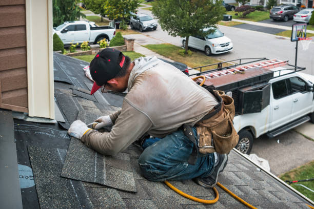 Professional Roof Replacement technician working in Wadesville, IN
